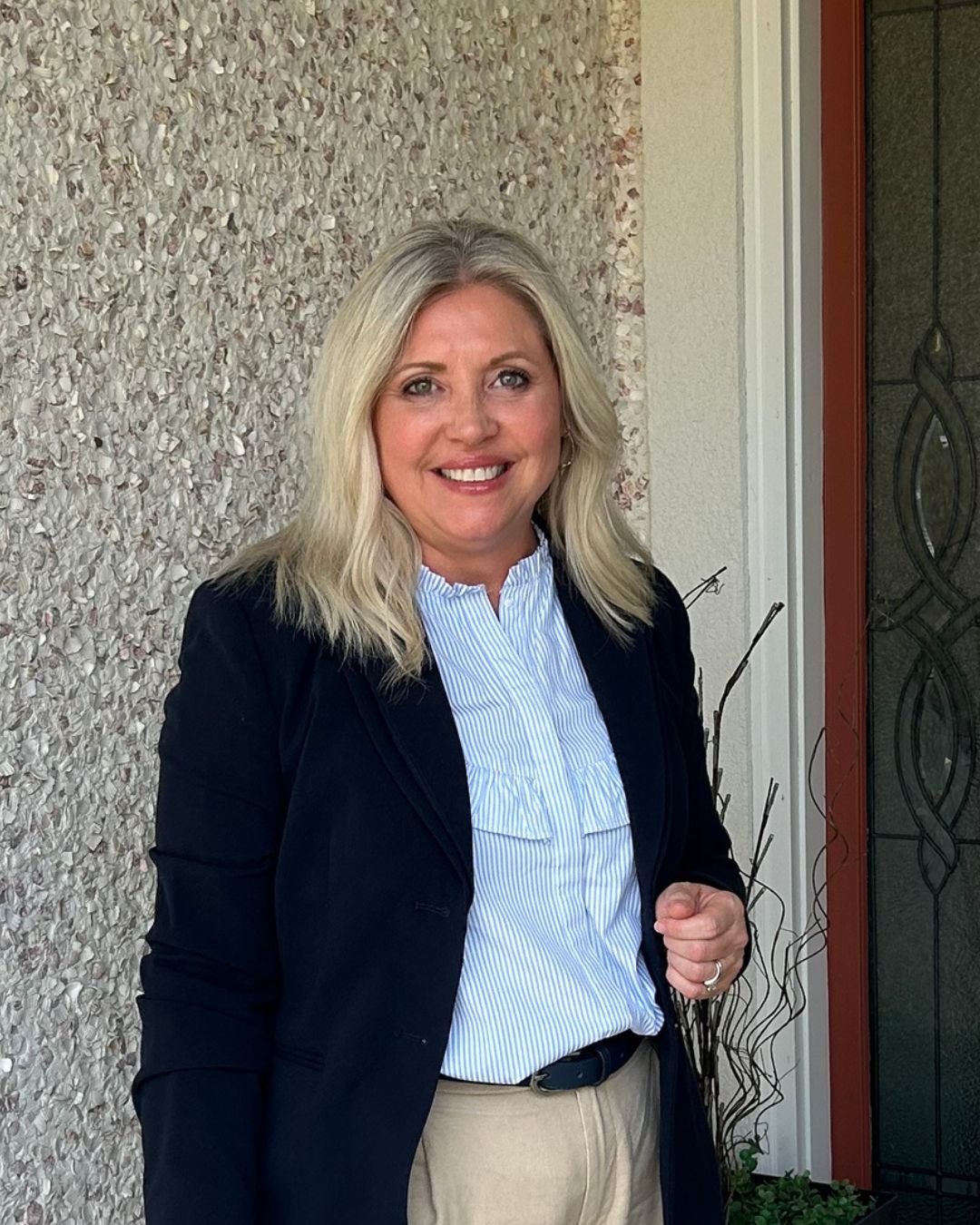 A Navy Blazer and Ruffled Stripe Shirt: Polished Workwear with Soft Detail